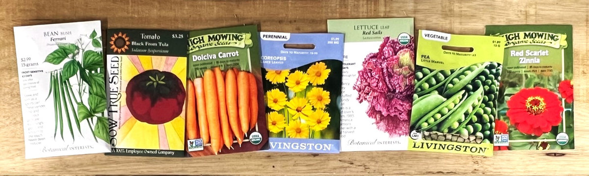 Seed packets from Botanical Interests, Sow True Seed, High Mowing Organic Seeds, and Livingston Seeds.
