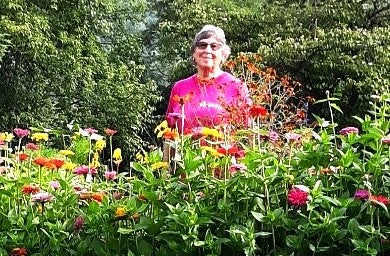 Wilma in her new Garden with zinnias cropped 2